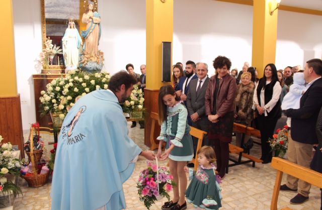 Los vecinos de La Estación-Esparragal homenajean a su patrona con la ofrenda floral